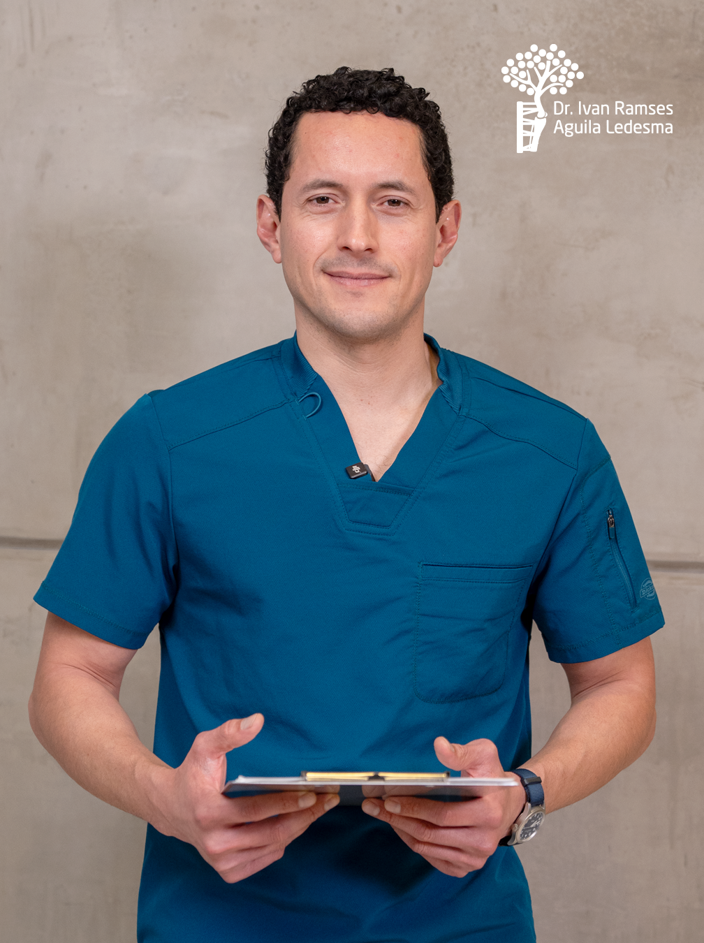 Dr. Iván Águila in clinical scrubs